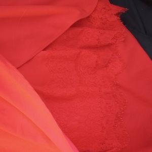 Red dress, red lace underneath, angled longer left side, adjustable straps